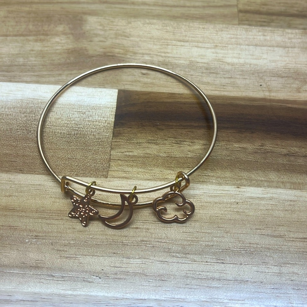 gold bangle bracelet with sky charms